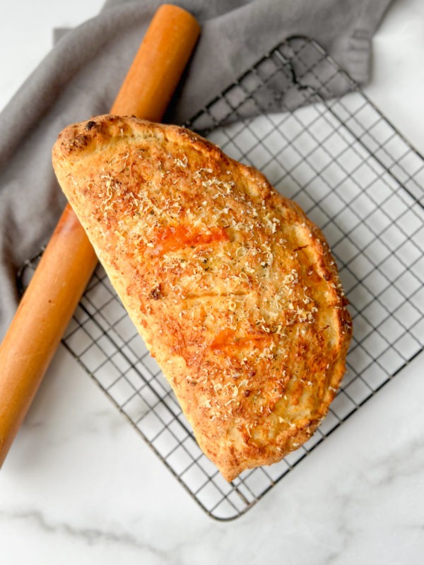 Savory Calzone – a delightful and folded Italian pizza turnover.
