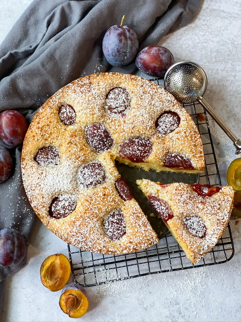 A delectable Gluten Free Plum Torte with fresh plums on top