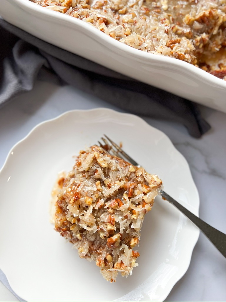 A slice of coconut cake, exemplifying the classic Southern dessert's rich flavors and simple elegance.